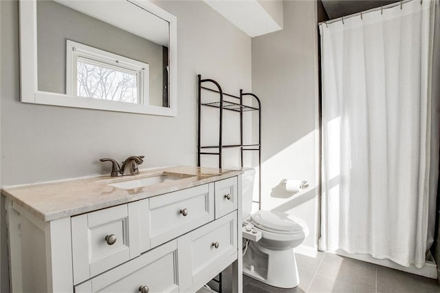 bathroom with tile patterned flooring, curtained shower, toilet, and vanity