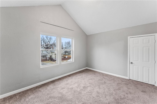 bonus room featuring lofted ceiling and carpet