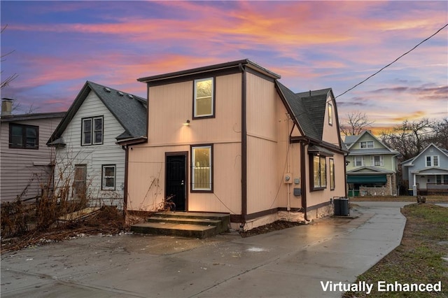 back house at dusk with central AC unit