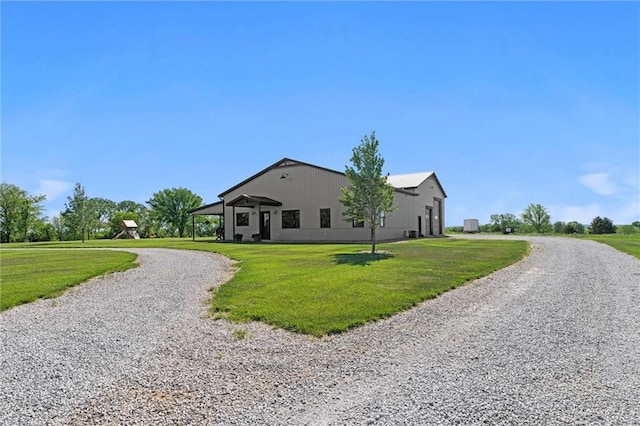 16140 214th St, Tonganoxie, KS 66086 - view of side of property featuring curved driveway and a lawn