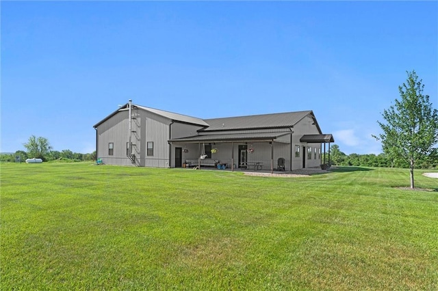 16140 214th St, Tonganoxie, KS 66086 - rear view of house with a yard