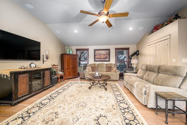 living room featuring recessed lighting, light wood finished floors, a ceiling fan, and vaulted ceiling