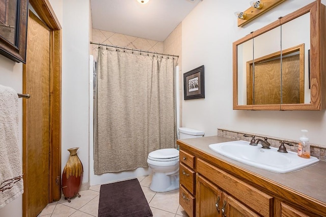 full bathroom featuring tile patterned flooring, toilet, and vanity