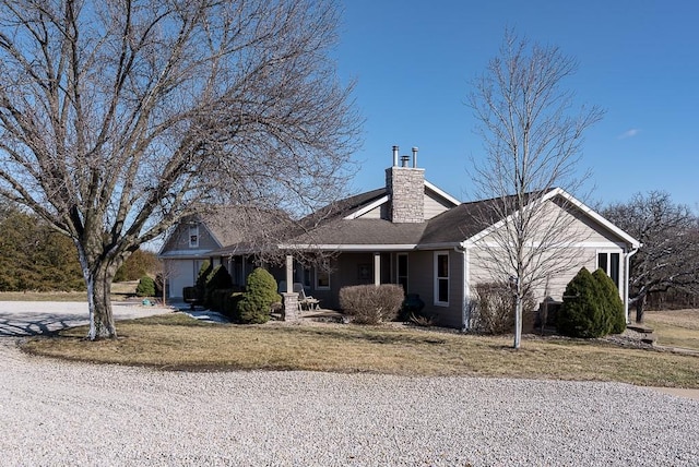 ranch-style house with a front lawn and a chimney