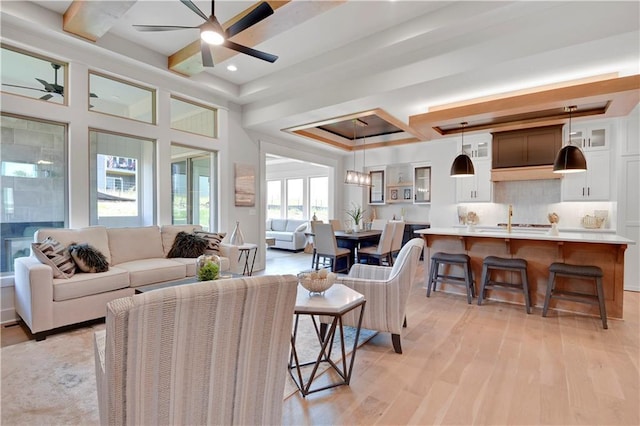 22109 W 93rd Ter, Lenexa, KS 66220 - living room with a ceiling fan, light wood-style flooring, coffered ceiling, recessed lighting, and beamed ceiling