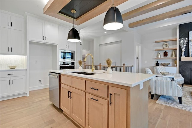 22109 W 93rd Ter, Lenexa, KS 66220 - kitchen with stainless steel appliances, light wood-style floors, light countertops, pendant lighting, and recessed lighting