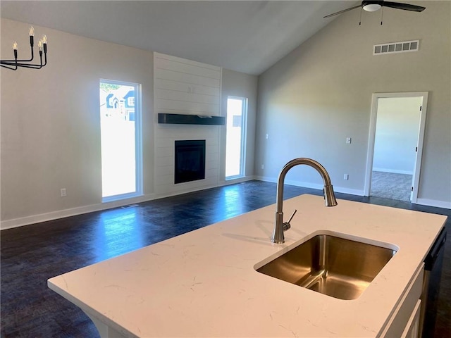 1102 Noah Ln, Kearney, MO 64060 - kitchen with open floor plan, healthy amount of natural light, a ceiling fan, and high vaulted ceiling