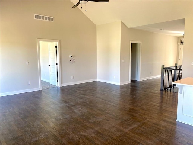 1102 Noah Ln, Kearney, MO 64060 - empty room with ceiling fan, dark wood-style floors, and high vaulted ceiling