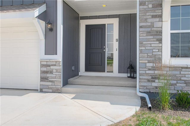 1102 Noah Ln, Kearney, MO 64060 - doorway to property with stone siding and a garage