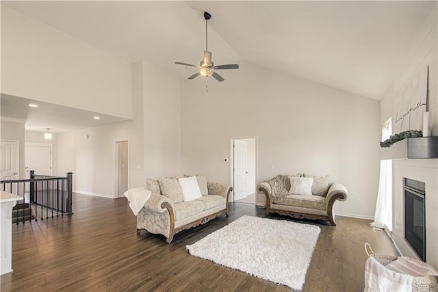 1102 Noah Ln, Kearney, MO 64060 - living room featuring high vaulted ceiling, dark wood-style flooring, ceiling fan, a glass covered fireplace, and recessed lighting