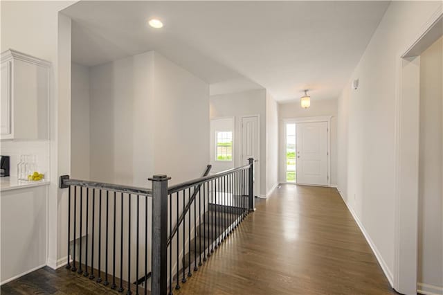 1102 Noah Ln, Kearney, MO 64060 - hall featuring an upstairs landing, dark wood finished floors, and recessed lighting