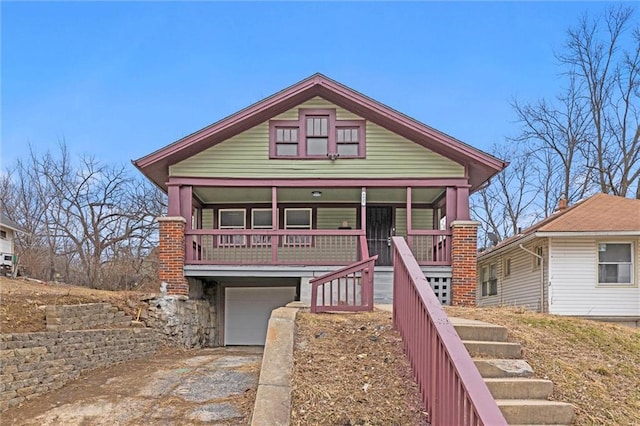 view of front facade featuring a garage and covered porch