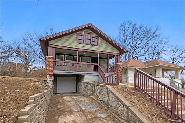 view of front facade featuring a garage and covered porch