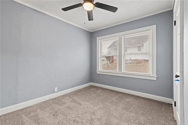 spare room with ceiling fan, carpet flooring, and a textured ceiling