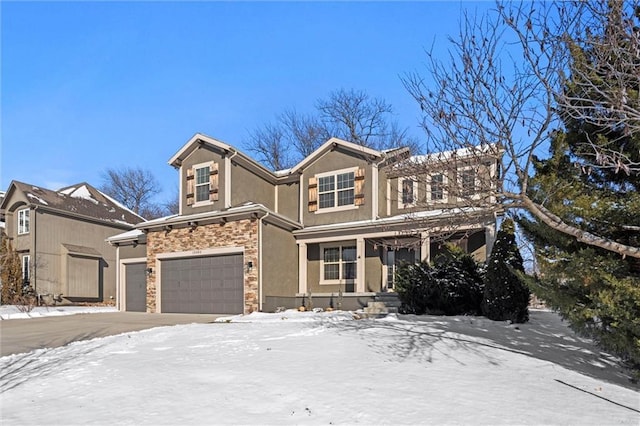 view of front of home featuring stone siding, an attached garage, and stucco siding