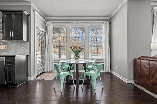 dining room featuring baseboards, dark wood-style flooring, and crown molding