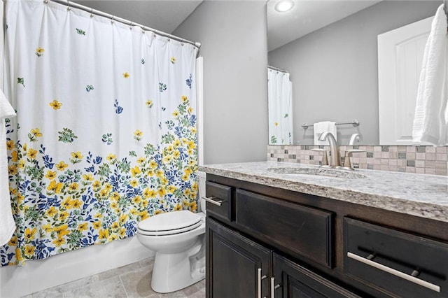 bathroom featuring tasteful backsplash, vanity, toilet, and tile patterned floors