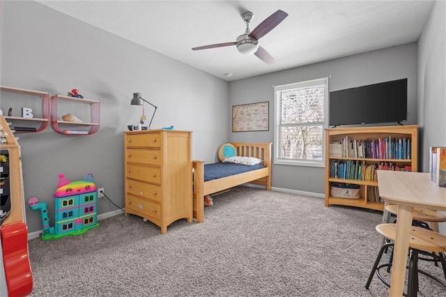 carpeted bedroom with a ceiling fan and baseboards