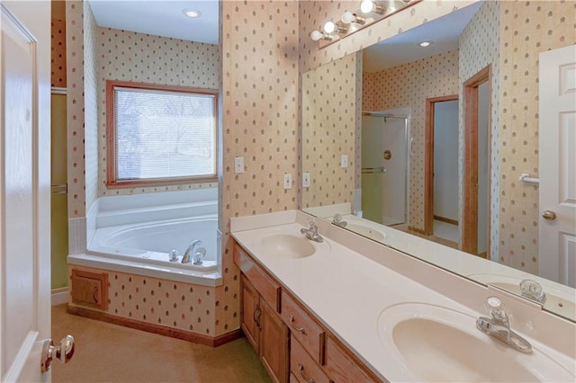 bathroom with independent shower and bath and vanity