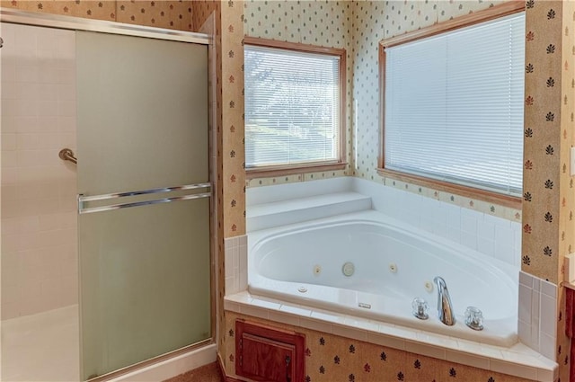 bathroom with separate shower and tub