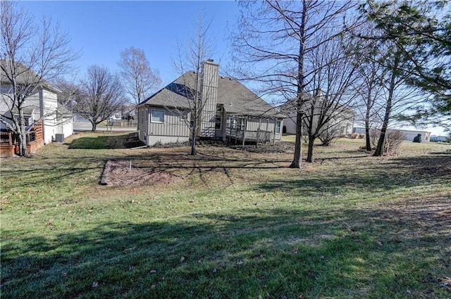 view of yard featuring a wooden deck