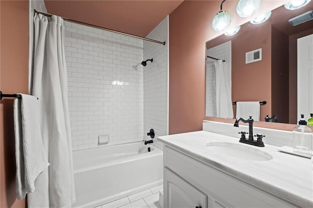 bathroom with shower / tub combo, vanity, and tile patterned floors