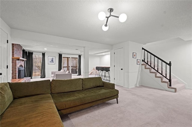 carpeted living room with a brick fireplace and a textured ceiling