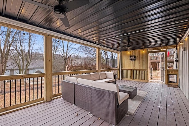 wooden deck featuring an outdoor hangout area and ceiling fan