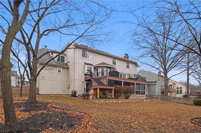 back of house featuring a balcony