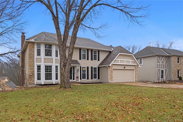 view of front facade with a garage and a front yard