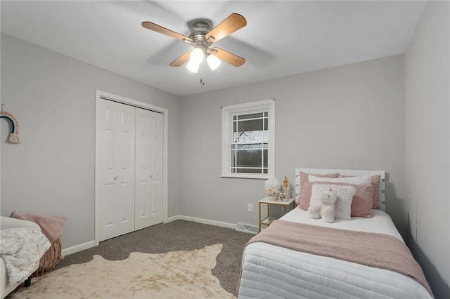 carpeted bedroom featuring ceiling fan and a closet