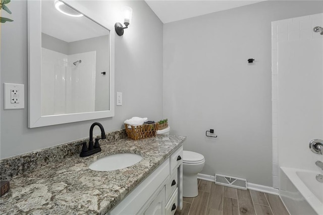 full bathroom featuring shower / tub combination, vanity, and toilet