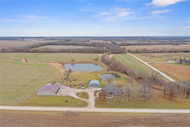 drone / aerial view with a rural view and a water view