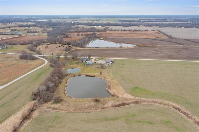 aerial view with a water view and a rural view