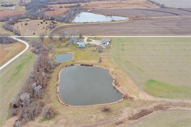 aerial view with a rural view and a water view