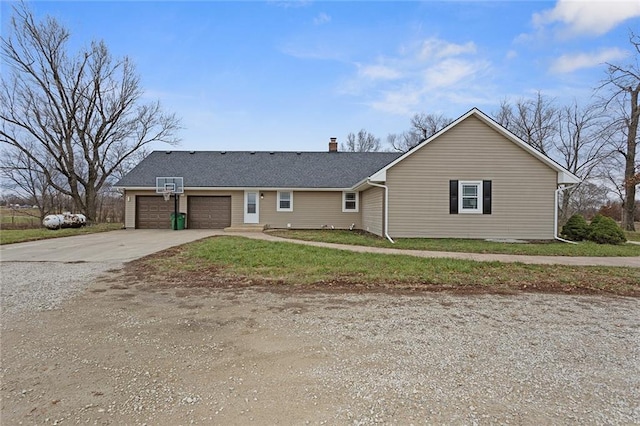 ranch-style home featuring a garage