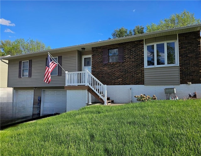 view of front of house with a garage and a front yard