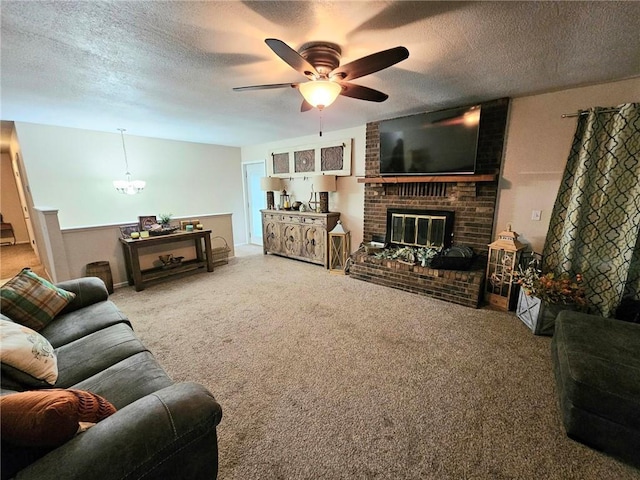 carpeted living room featuring a brick fireplace, a textured ceiling, and ceiling fan