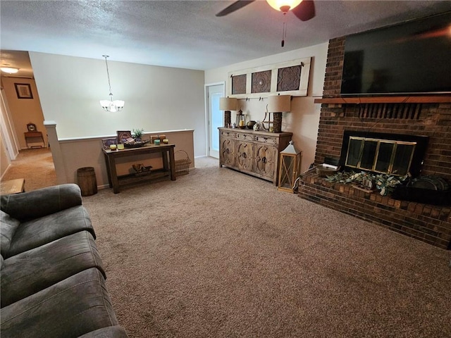 living room featuring a brick fireplace, ceiling fan with notable chandelier, a textured ceiling, and carpet flooring