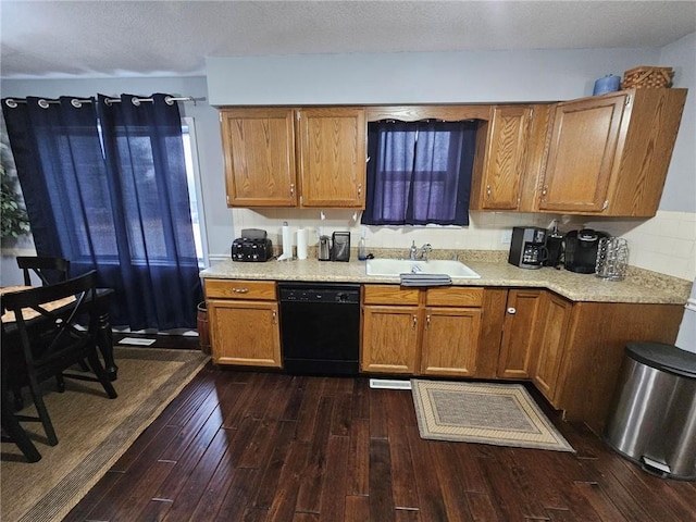 kitchen featuring black dishwasher, sink, dark wood-type flooring, and decorative backsplash