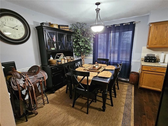 dining area featuring dark hardwood / wood-style floors