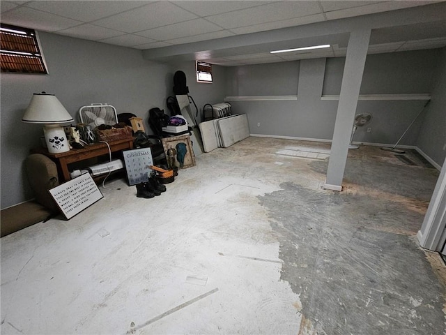 basement featuring a paneled ceiling