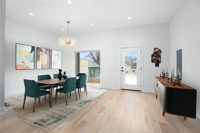 dining area featuring a chandelier, baseboards, light wood-style flooring, and recessed lighting