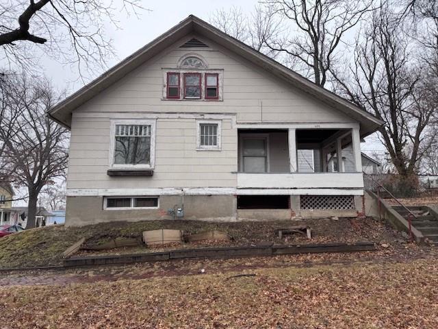 view of side of home featuring a porch