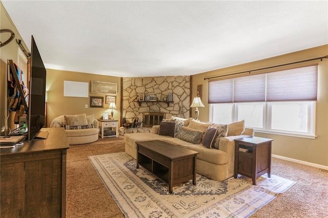 living room with baseboards, light carpet, and a fireplace