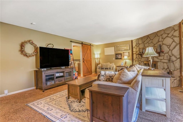 living room with light colored carpet, baseboards, and a barn door