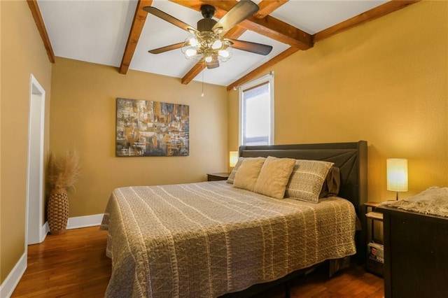 bedroom featuring beamed ceiling, baseboards, wood finished floors, and a ceiling fan