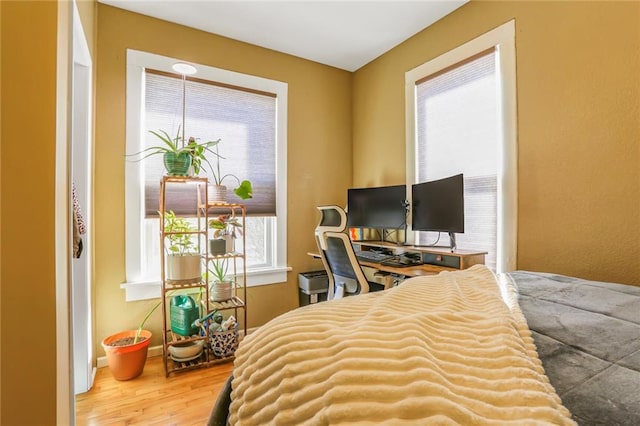 bedroom featuring wood finished floors