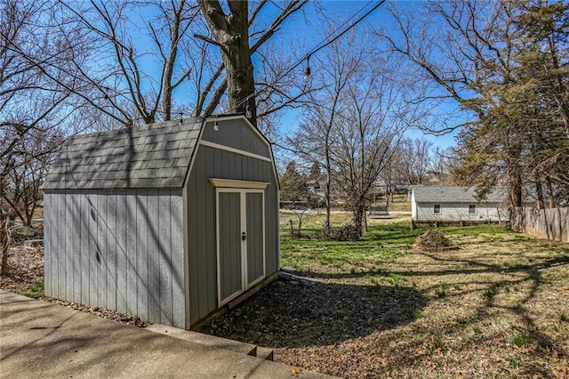 view of shed with fence