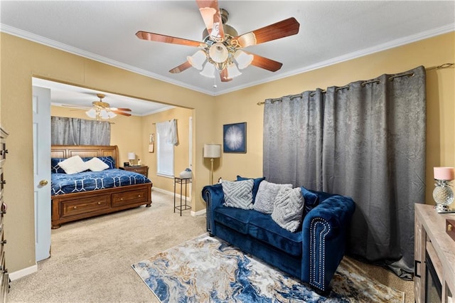 carpeted bedroom with ceiling fan, baseboards, and ornamental molding